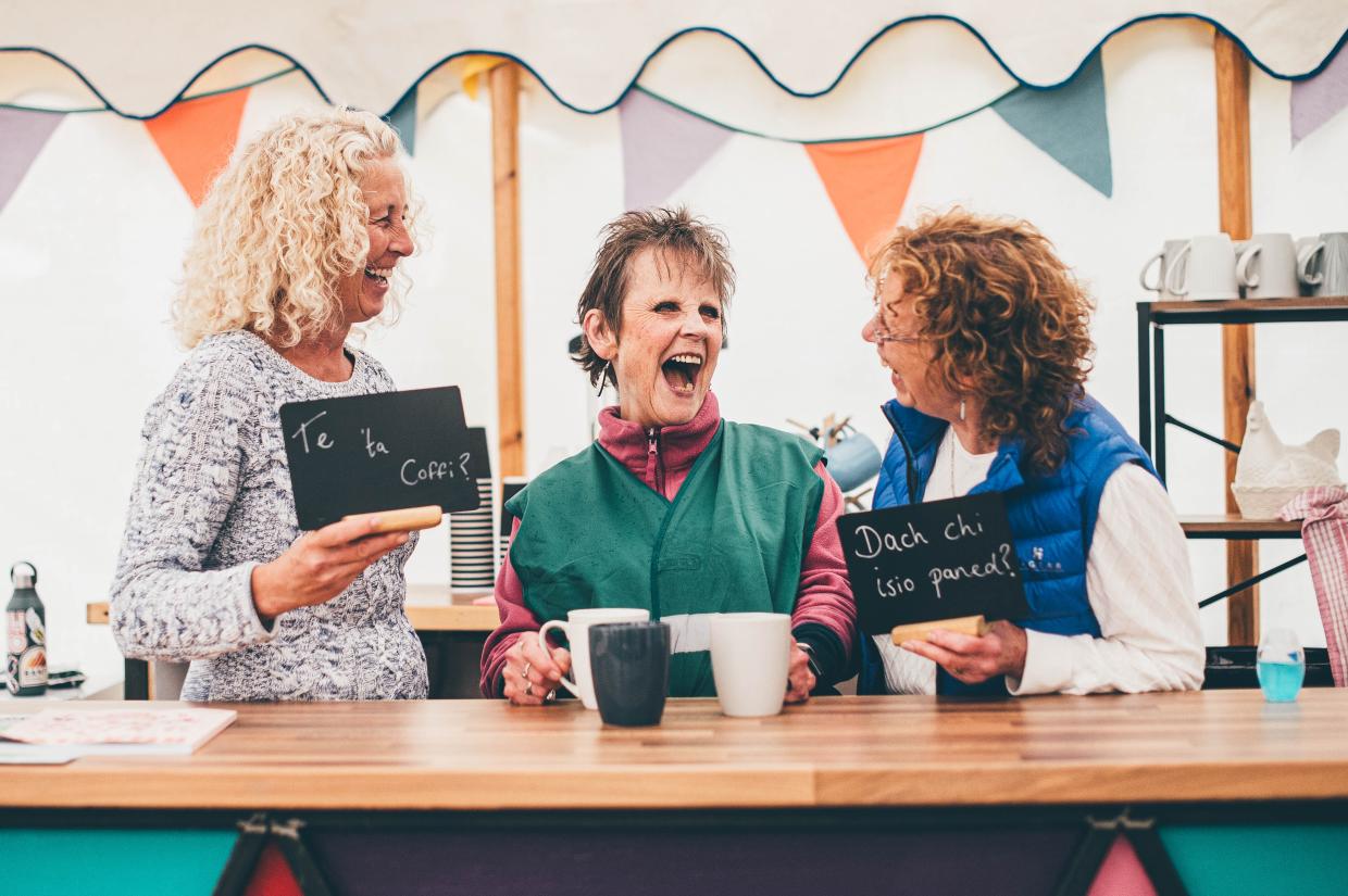 Volunteers chatting and laughing at festival